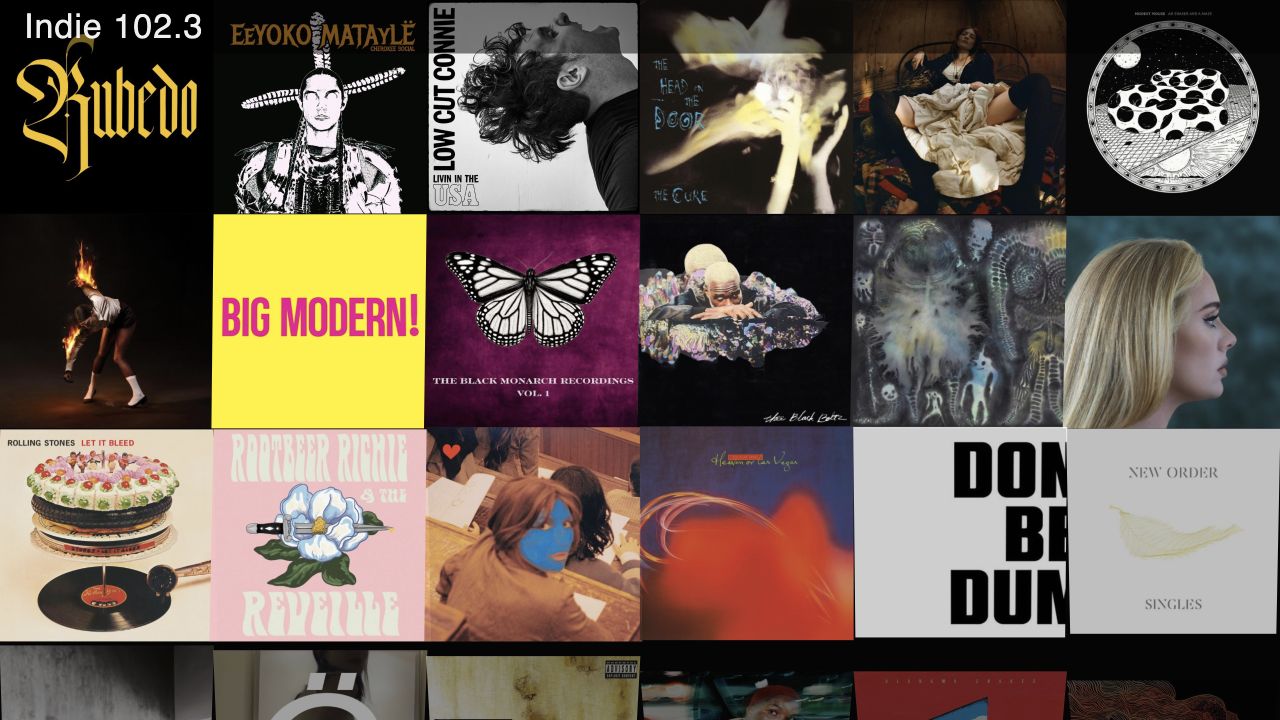 Indie 102.3 album cover wall with the station name overlay